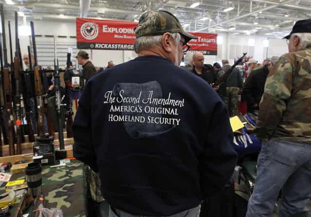 A sweatshirt states the position of many gun supporters at Washington County Fairgrounds Gun Show that drew thousands of people over the weekend, on March 22, 2013. (Photo by Gary Porter)