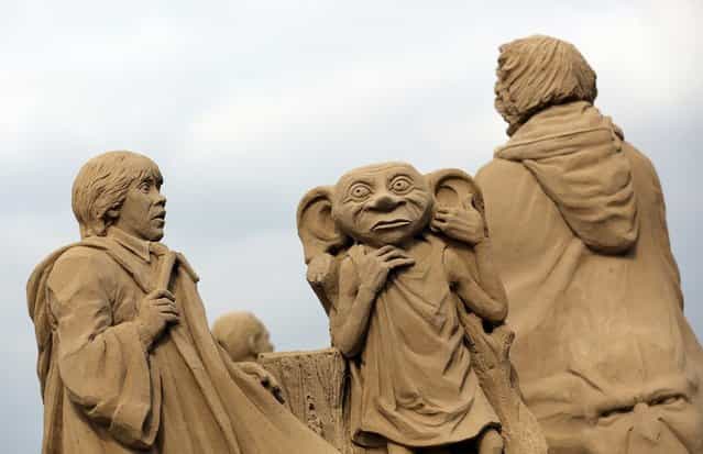 Detail of a sand sculpture of Harry Potter is seen as pieces are prepared as part of this year's Hollywood themed annual Weston-super-Mare Sand Sculpture festival on March 26, 2013 in Weston-Super-Mare, England. Due to open on Good Friday, currently twenty award winning sand sculptors from across the globe are working to create sand sculptures including Harry Potter, Marilyn Monroe and characters from the Star Wars films as part of the town's very own movie themed festival on the beach. (Photo by Matt Cardy)