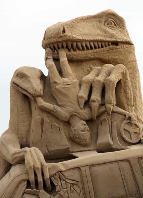 Detail of a sand sculpture of Jurassic Park is seen as pieces are prepared as part of this year's Hollywood themed annual Weston-super-Mare Sand Sculpture festival on March 26, 2013 in Weston-Super-Mare, England. Due to open on Good Friday, currently twenty award winning sand sculptors from across the globe are working to create sand sculptures including Harry Potter, Marilyn Monroe and characters from the Star Wars films as part of the town's very own movie themed festival on the beach. (Photo by Matt Cardy)