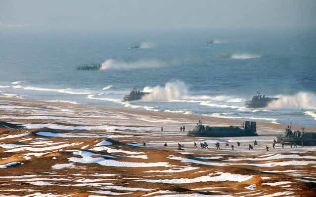 [Excessive digital alteration] used in official photo showing North Korean Army landing drills on March 26, 2013. Photos had additional ships added to depict more intimidating military presence. The Korean Central News Agency (KCNA) released a photo Tuesday of hovercrafts carrying marines to storm a beach. The Agence France-Presse (AFP), along with other news agencies, published the image but later pulled it due to [excessive digital alteration]. (Photo by AFP Photo/KCNA)