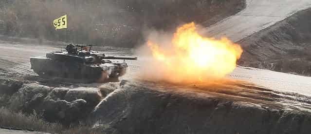 South Korean soldiers from an armored unit participate in a field firing in Pocheon, 46 km (28 miles) northeast of Seoul and about 15 km (9 miles) south of the demilitarized zone separating the two Koreas, March 27, 2013. North Korea is to cut the last channel of communications with South Korea because war could break out at [any moment], it said on Wednesday, days of after warning the United States and South Korea of nuclear attack. (Photo by Lim Byong-sik/Reuters)