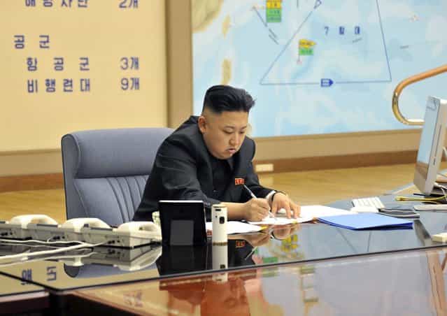 A picture released by the North Korean Central News Agency (KCNA) shows Kim Jong-un convening an urgent operation meeting at 0:30 am on March 29, 2013 at an undisclosed location, in which he ordered strategic rocket forces to be on standby to strike US and South Korean targets at any time. (Photo by KCNA via EPA)