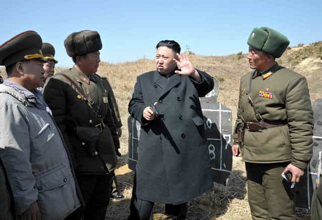 Kim Jong Un inspects the second battalion under the Korean People's Army Unit 1973, honored with the title of [O Jung Hup-led 7th Regiment], on March 23, 2013, in this picture released on March 24, 2013. (Photo by Reuters/KCNA)