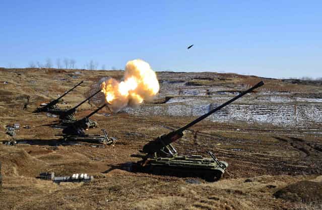 North Korea's artillery sub-units, whose mission is to strike Daeyeonpyeong island and Baengnyeong island of South Korea, conduct a live shell firing drill in this picture released on March 14, 2013. (Photo by Reuters/KCNA)
