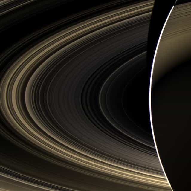 An image from NASA's Cassini orbiter shows Saturn and its rings, with the planet Venus shining as a white speck just above and to the right of the image's center. The picture was captured by Cassini's wide-angle camera on November 10, 2012, and released on March 4. (Photo by NASA/JPL-Caltech/Space Science Institute via AFP Photo)