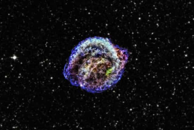 This supernova, discovered in 1604 by Johannes Kepler, belongs to an important class of objects that are used to measure the rate of expansion of the universe, known as Type 1a supernovae. The view you see here, released March 18, 2013 was produced using data from NASA's Chandra X-ray Observatory as well as infrared and optical imagery. The Chandra X-ray observations led astronomers to conclude that the supernova was triggered by interaction between a white dwarf and a red giant star. (Photo by CXC/NASA/JPL-Caltech)