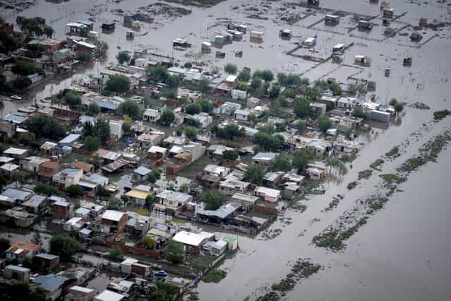 An aerial view of flooded streets is pictured after heavy rains in La Plata April 3, 2013. At least 46 people were killed in Argentina on Wednesday after a torrential downpour battered the eastern city of La Plata and forced some 2,200 people to flee their homes in search of dry ground. (Photo by Reuters/Infobae.com)