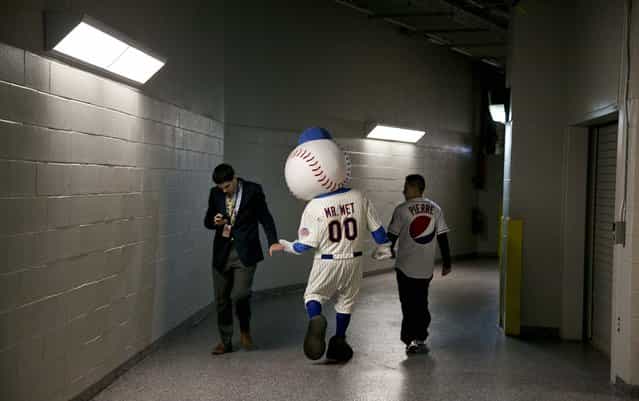 Mr. Met, the New York Mets' mascot, walks the halls of Citi Field in New York before the Mets' season opener against the Sand Diego Padres, on April 1, 2013. (Photo by Todd Heisler/The New York Times)