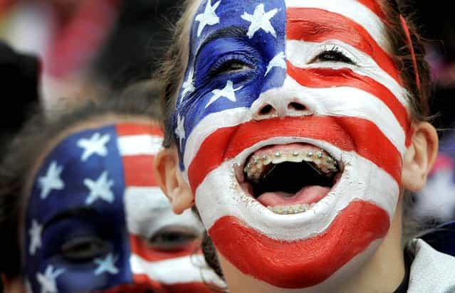 Fans of the United States cheer before the beginning of the international friendly women's soccer match between Germany and the United States in Offenbach, Germany, on April 5, 2013. (Photo by Jens Meyer/Associated Press)