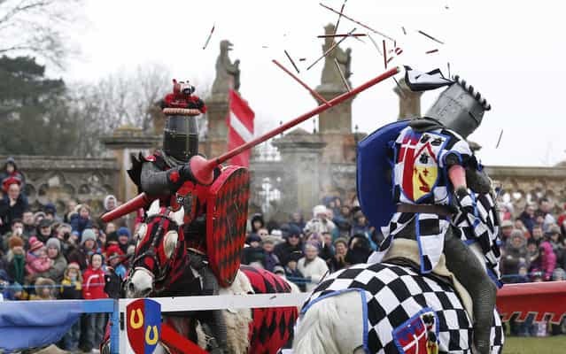 Performers dressed as medieval knights joust at Knebworth House in Hertfordshire April 1, 2013. Knebworth House, a stately home of the Lytton family since 1490, hosted The Knights Of Royal England in their first medieval jousting tournament of the season. (Photo by Olivia Harris/Reuters)
