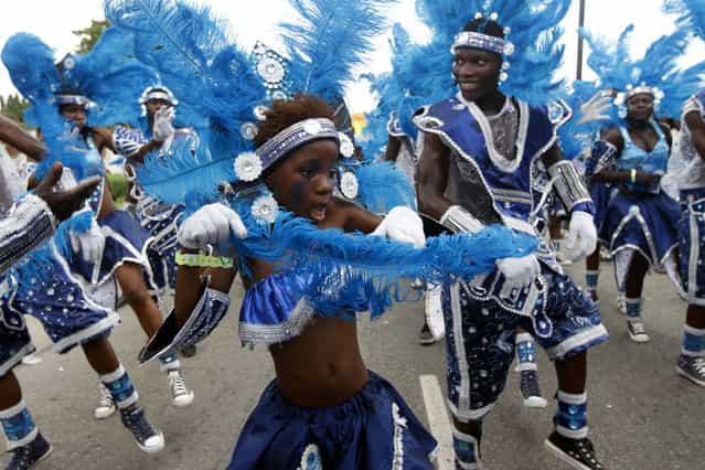 Participants attend a street carnival marking the end of Easter celebrations at Tafawa Balewa square in Nigeria's commercial capital L

<div class=