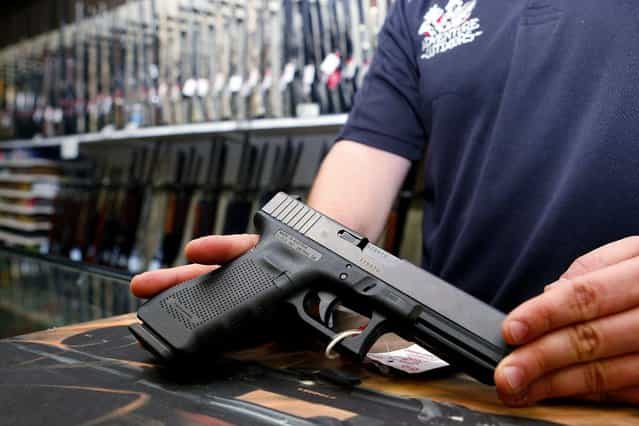 A Glock handgun available in a raffle promotion is shown at Adventures Outdoors in Smyrna, Georgia, October 25, 2012. The store has promoted the raffle on billboards as a [Vote. Win a rifle]. but owner Jay Wallace has stated that all Georgia residents are eligible to enter. (Photo by Tami Chappell/Reuters)