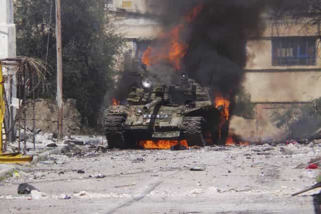 A burning tank is in Daraa, on March 9, 2013. (Photo by Ali Abu-Salah/Reuters/Shaam News Network /The Atlantic)