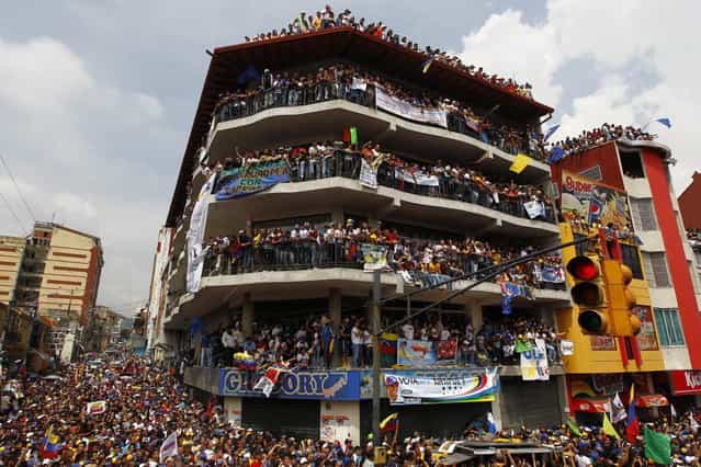 Supporters of Venezuela's opposition leader and presidential candidate Henrique Capriles attend a campaign rally in the state of Merida April 10, 2013. Venezuelans will hold presidential elections on April 14. (Photo by Carlos Garcia Rawlins/Reuters)
