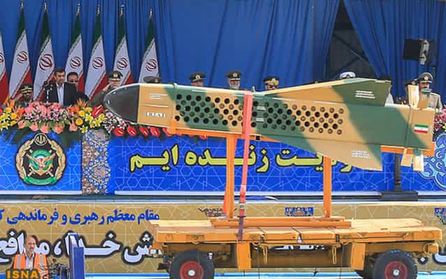 Iranian President Mahmoud Ahmadinejad (left) view the Iranian missile during military parade celebrating the country's Army Day in Tehran, on April 18, 2013. (Photo by Hamid Forootan/ISNA)
