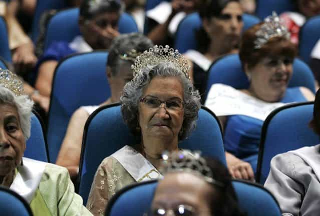 Elderly women wearing tiaras sit in the audience during a beauty pageant for elderly women called the [Queen of the Elderly] in Guadalajara, Mexico, on April 17, 2013. Eight contestants, ranging in age from 65-75, answered questions about their lives and what it means to be a senior citizen in today's society, as they competed in the annual event to win the top prize of a handbag and jewellery creations by local designers. (Photo by Alejandro Acosta/Reuters)