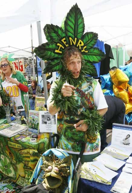 A man calling himself Henry Hemp works a vendor booth at the 4/20 marijuana holiday in Civic Center Park in downtown Denver April 20, 2013. (Photo by Rick Wilking/Reuters)
