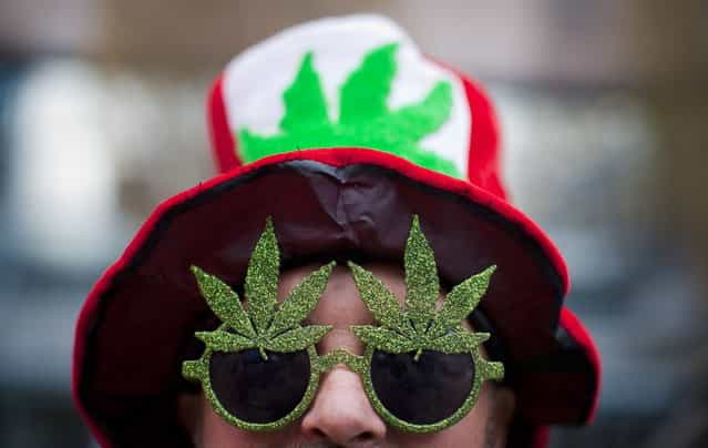 A man, wearing a marijuana-themed hat and sunglasses, is pictured at the Vancouver Art Gallery during the annual 4/20 day, which promotes the use of marijuana, in Vancouver, British Columbia April 20, 2013. (Photo by Ben Nelms/Reuters)