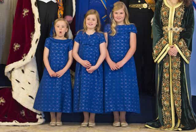Dutch Crown Princess Catharina-Amalia (L), Princess Ariane (C) and Princess Alexia pose during a photocall at the royal palace in Amsterdam following the crowning ceremonies April 30, 2013. The Netherlands is celebrating Queen's Day on Tuesday, which also marks the abdication of Queen Beatrix and the investiture of her eldest son Willem-Alexander. (Photo by Michel Porro/Reuters)