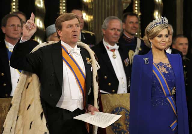 Dutch King Willem-Alexander takes the oath next to his wife Queen Maxima during a religious ceremony at the Nieuwe Kerk church in Amsterdam April 30, 2013. The Netherlands is celebrating Queen's Day on Tuesday, which also marks the abdication of Queen Beatrix and the investiture of her eldest son Willem-Alexander. (Photo by Peter Dejong/Reuters)