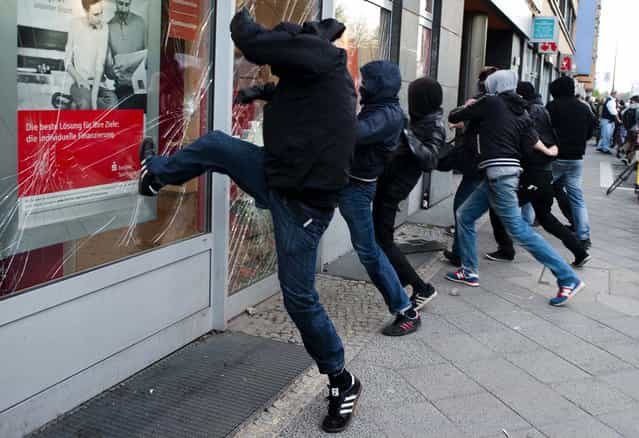 Left wing activists attack a bank during May Day demonstrations in Berlin. (Photo by Markus Schreiber/Associated Press)