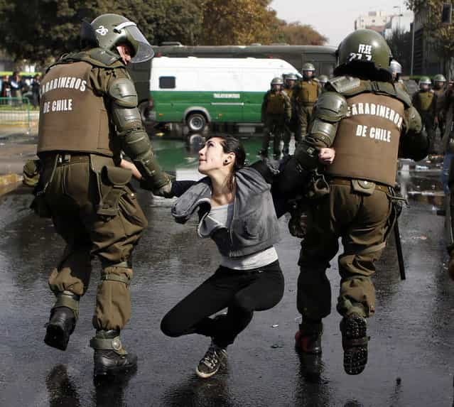 A demonstrator is detained during May Day rallies in Santiago May 1, 2013. (Photo by Ivan Alvarado/Reuters)