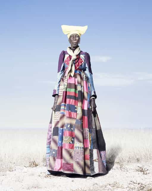 An elderly Herero woman in patchwork dress and pale scarf, 2012. As Herero women get older, the [horns] of their headdresses get smaller. According to some accounts, this is to symbolize their loss of fertility. (Photo by Jim Naughten, courtesy of Klompching Gallery, New York)