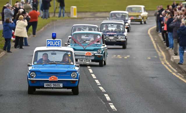 Hilman Imp enthusiasts drive their vehicles outside the former car factory as they celebrate the car's 50th anniversary in Linwood, Scotland, on May 3, 2013. (Photo by Jeff J. Mitchell/Getty Images)