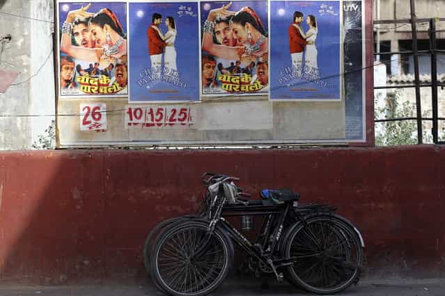 Posters for a low budget Hindi film are pasted onto the wall of a cinema in Meerut in the northern Indian state of Uttar Pradesh April 28, 2013. (Photo by Danish Siddiqui/Reuters)