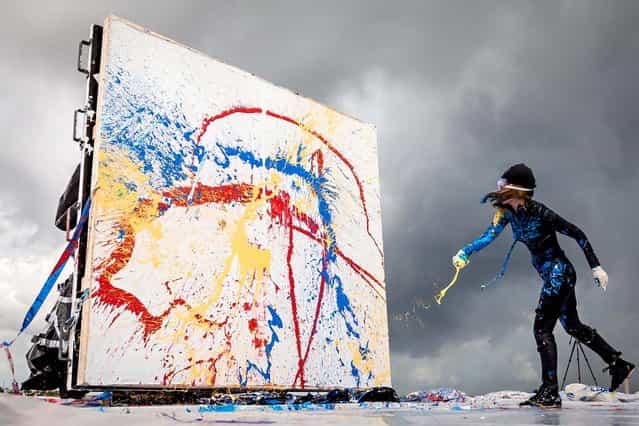 Princess Tarinan works on a canvas. (Photo by Thomas Cordy/The Palm Beach Post)