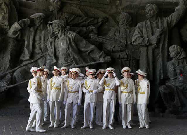 Cadets of the Ukrainian Military academy prepare to celebrate the anniversary of victory over the Nazis at a memorial to World War II veterans in Kiev on Thursday. Ukrainians continue to celebrate the World War II anniversary and Victory Day on May 9 as a national holiday. (Photo by Efrem Lukatsky/Associated Press)