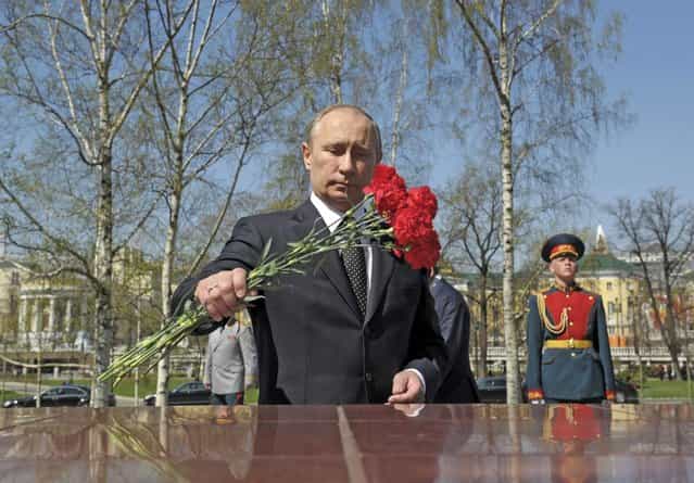 Russia President Vladimir Putin takes part in a wreath laying ceremony at the tomb of the unknown soldier on the eve of Victory Day in Moscow May 8, 2013. (Photo by Alexei Druzhinin/Reuters/RIA Novosti)