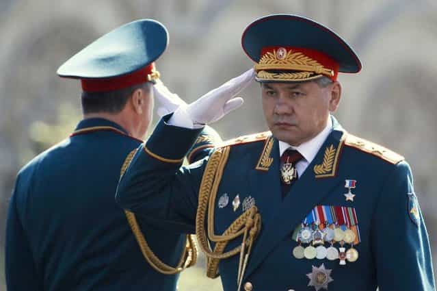 Russian Defence Minister Sergei Shoigu (R) salutes during the Victory Parade on Moscow's Red Square May 9, 2013. Russia commemorates the 68th anniversary of the Soviet Union's victory over Nazi Germany on May 9. (Photo by Sergei Karpukhin/Reuters)