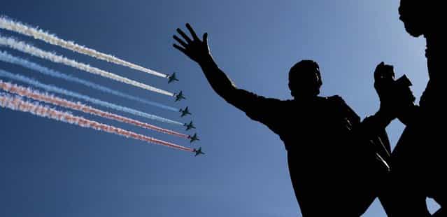 Russian air force fighters fly over Red Square during Thursday's Victory Day parade. (Photo by Ivan Sekretarev/Associated Press)