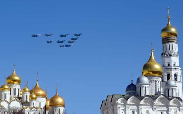 Russian army jet fly over an Orthodox Christian church during a rehearsal for the Victory Day parade in Moscow. Russia marks victory over Nazi Germany in World War Two every year on May 9. (Photo by Andrey Smirnov/AFP Photo)