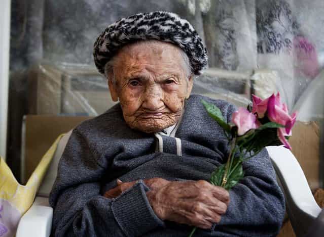 Amalia Lopez, who is 114-years-old, poses for a portrait inside her home on Mother's Day in Mexico City, on May 10, 2013. Lopez was honored by the city for being the oldest living woman in Mexico City. Lopez has survived her four children, and has 15 grandchildren and three great-grandchildren. Lopez was born on July 10, 1898, and will turn 115 this July 10. (Photo by Eduardo Verdugo/Associated Press)