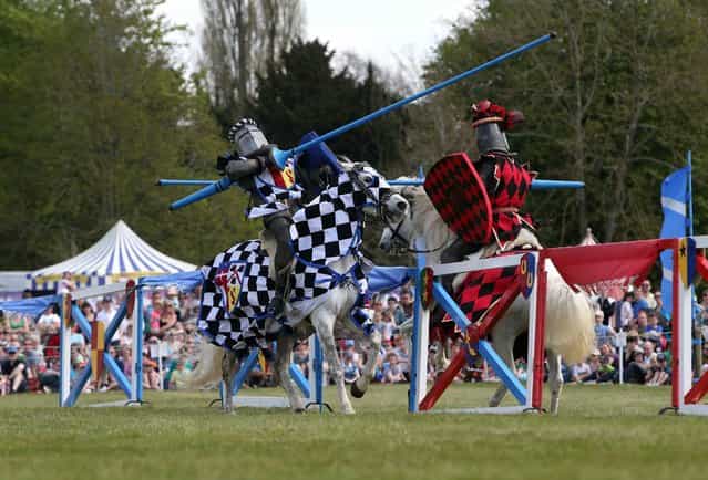 Sir Jasper (left) and Sir Sam (right) from the Knights of Royal England perform in a jousting tournament at Blenheim Palace, near Woodstock, Oxfordshire, on May 6, 2013. (Photo by Steve Parsons/PA Wire)