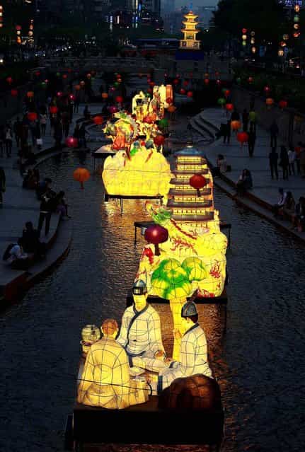 Lanterns are displayed to celebrate Buddha's birthday along a stream in Seoul. (Photo by Ahn Young-joon/Associated Press)
