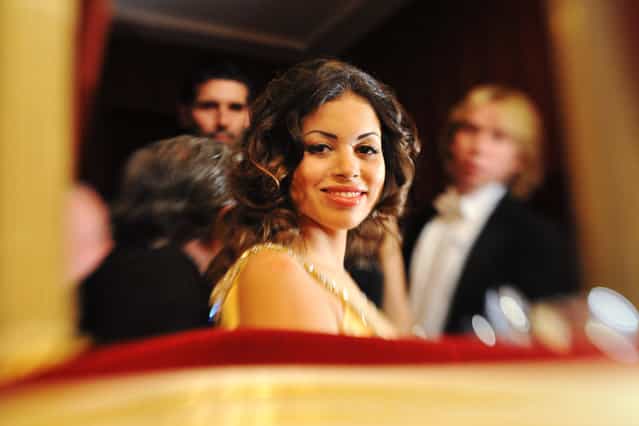 Karima El Mahroug enjoys the company of her host Austrian businessman Richard Lugner during the traditional Opera Ball at the state opera in Vienna on March 3, 2011. Karima el-Mahroug nicknamed Ruby, is the woman at the centre of a sex scandal which is engulfing Italian Prime Minister Silvio Berlusconi. (Photo by Joe Klamar/AFP Photo)