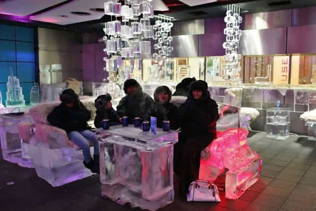 A Saudi Arabian family drinks hot chocolate at Chillout cafe in Dubai May 12, 2013. (Photo by Ahmed Jadallah/Reuters)