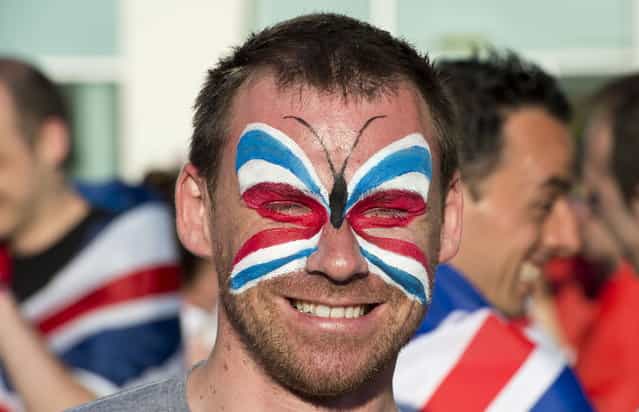 A British fan waits to enter the Malmo arena ahead of the finals of the 2013 Eurovision Song Contest on May 18, 2013. (Photo by John MacDougall/AFP Photo)