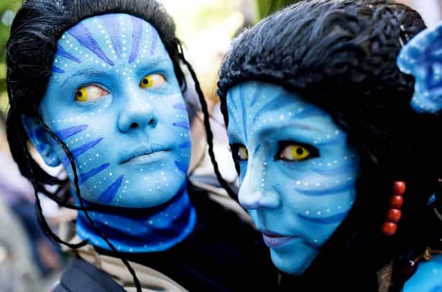 Revelers dressed as Neytiri from the movie [Avatar] participate in the Carnival Of Cultures parade in Berlin, on May 19, 2013. (Photo by Gero Breloer/Associated Press)