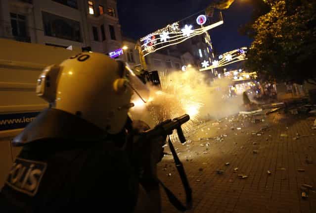 Riot police use tear gas to disperse the crowd during an anti-government protests at Taksim Square in central Istanbul May 31, 2013. (Photo by Murad Sezer/Reuters)