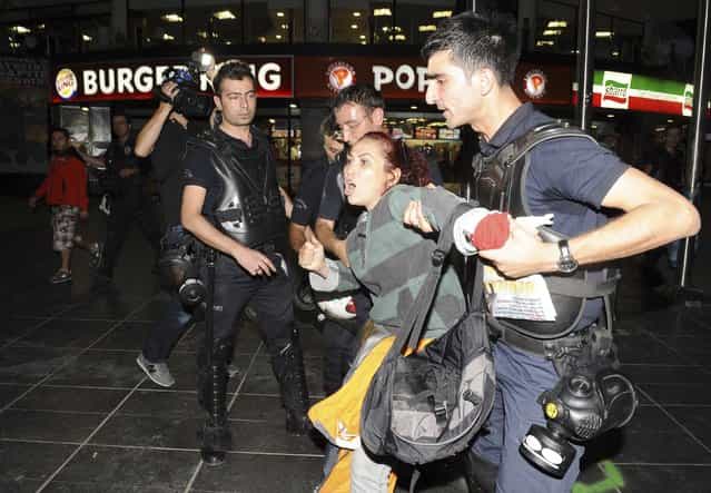 Riot police detain a protester during demonstrations against Turkey's Prime Minister Tayyip Erdogan and his ruling AK Party in central Ankara June 2, 2013. Erdogan accused Turkey's main secular opposition party on Sunday of stirring a wave of anti-government protests, as tens of thousands regrouped in Istanbul and Ankara after a lull and trouble flared again in the capital. Police used tear gas on protesters in Ankara but the clashes were relatively minor compared with major violence in Turkey's biggest cities on the previous two days. (Photo by Reuters/Stringer)