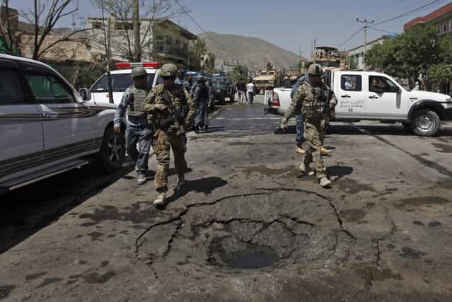 NATO soldiers with the International Security Assistance Force (ISAF) arrive at the site of a suicide attack in Kabul May 16, 2013. (Photo by Mohammad Ismail/Reuters)