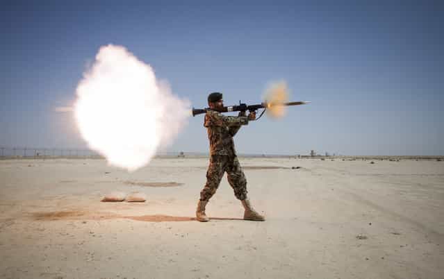 An Afghan National Army soldier assigned to the Mobile Strike Force Kandak fires an RPG-7 rocket-propelled grenade launcher during a live-fire exercise supervised by the Marines with the Mobile Strike Force Advisor Team on Camp Shorabak, Helmand province, Afghanistan, on May 20, 2013. (Photo by Staff Sgt. Ezekiel R. KitandweUSMC)
