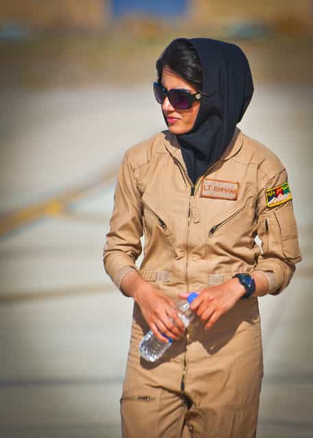 Afghan air force 2nd Lt. Niloofar Rhmani walks the flight line at Shindand Air Base, Afghanistan, prior to her graduation from undergraduate pilot training, on May 13, 2013. Rhmani made history on May 14, when she became the first female to successfully complete undergraduate pilot training and earn the status of pilot in more than 30 years. She will continue her service as she joins the Kabul Air Wing as a Cessna 208 pilot. (Photo by Senior Airman Scott Saldukas/USAF)