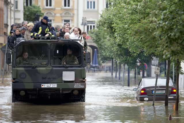 Residents of flooded areas in Gera, eastern Germany are evacuated on June 3, 2013. Parts of the eastern and southern Germany were flooded due to heavy and ongoing rainfalls. (Photo by Marc Tirl/AFP Photo)