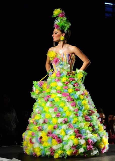 A model presents a creation made of plastic bags and straws during Trash Fashion Show in Macedonia's capital Skopje, on Wednesday, June 5, 2013. Teams from 47 high schools from Macedonia participated in the show with creations made of redesigned materials from waste such as plastic bags, newspapers, cardboard, plastic bottles, cans, used paper, etc. (Photo by Boris Grdanoski/AP Photo)