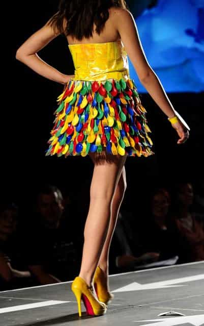A model presents a creation made of plastic cutlery during Trash Fashion Show in Macedonia's capital Skopje, on Wednesday, June 5, 2013. Teams from 47 high schools from Macedonia participated in the show with creations made of redesigned materials from waste such as plastic bags, newspapers, cardboard, plastic bottles, cans, used paper, etc. (Photo by Boris Grdanoski/AP Photo)